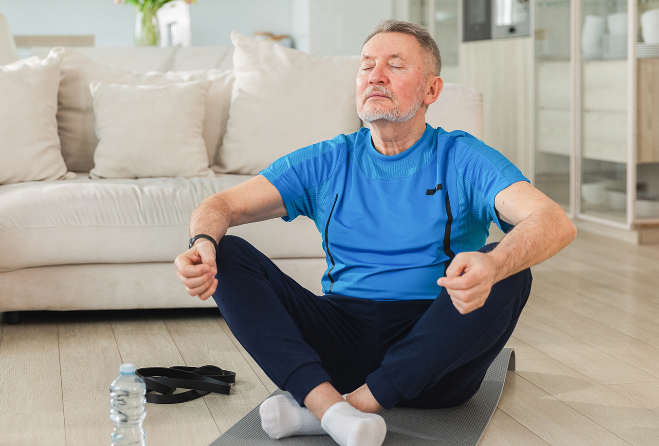 Elderly man doing yoga