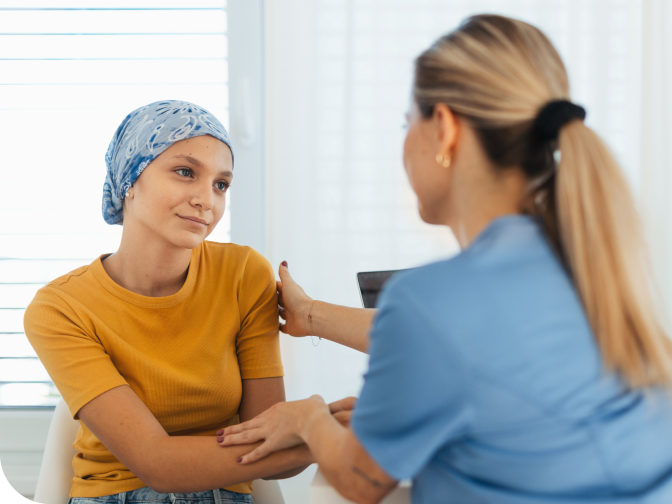 Nurse comforting a cancer patient