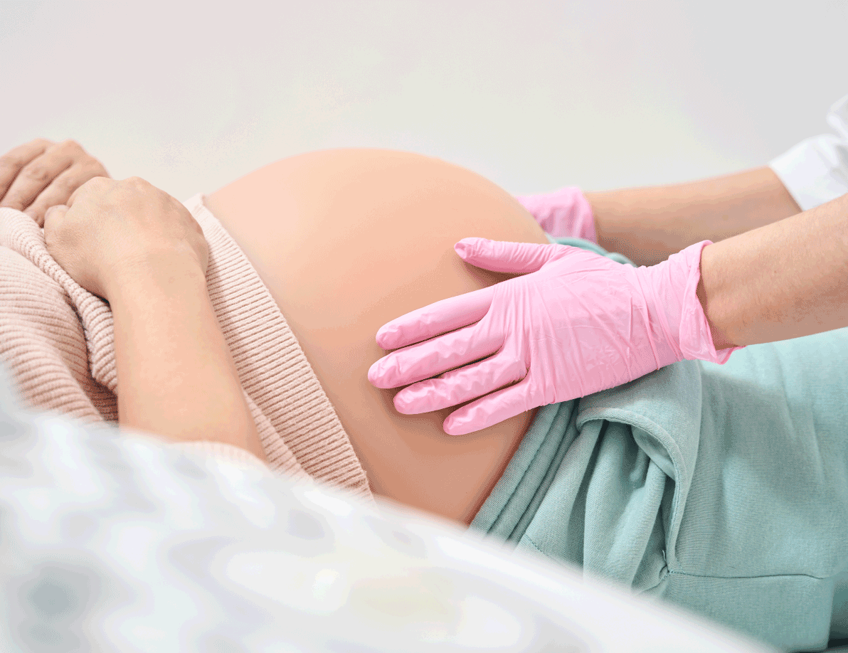 Nurse checking on pregnant patient's stomach