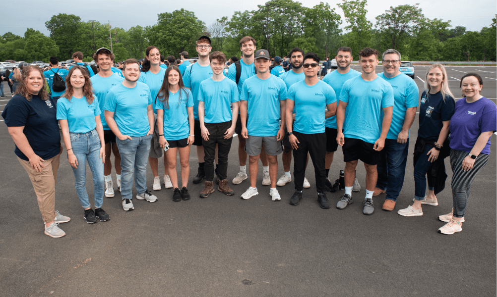 Group picture of interns wearing the same shirt