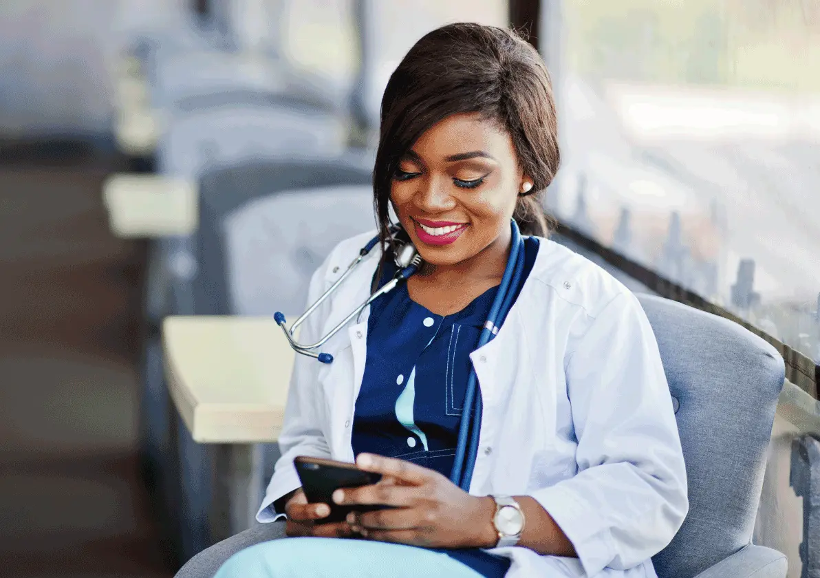 Medical professional working on mobile device