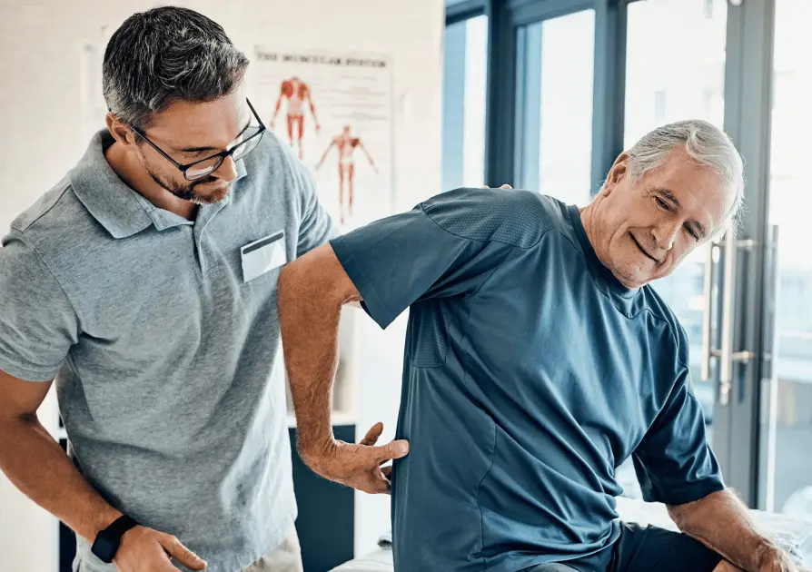 Chiropractor checking on a patient's back