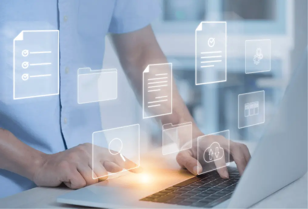 Medical professional typing on a laptop