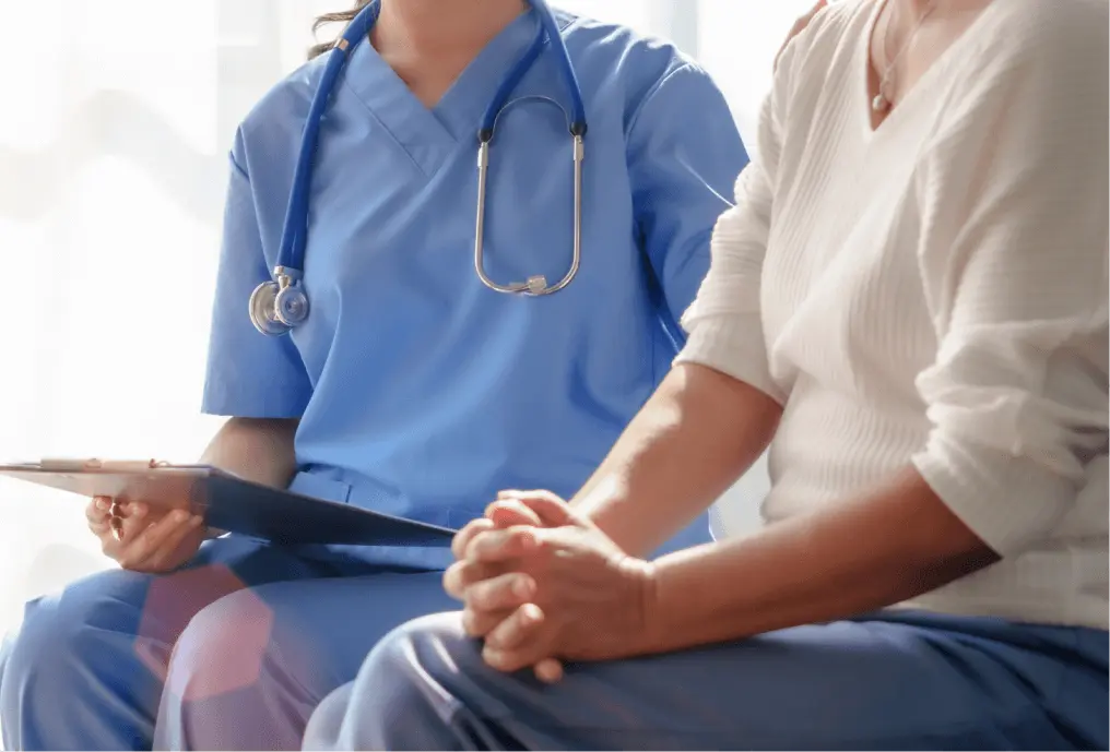 Nurse speaking with patient