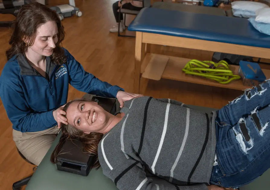 Physical Therapist working with patient