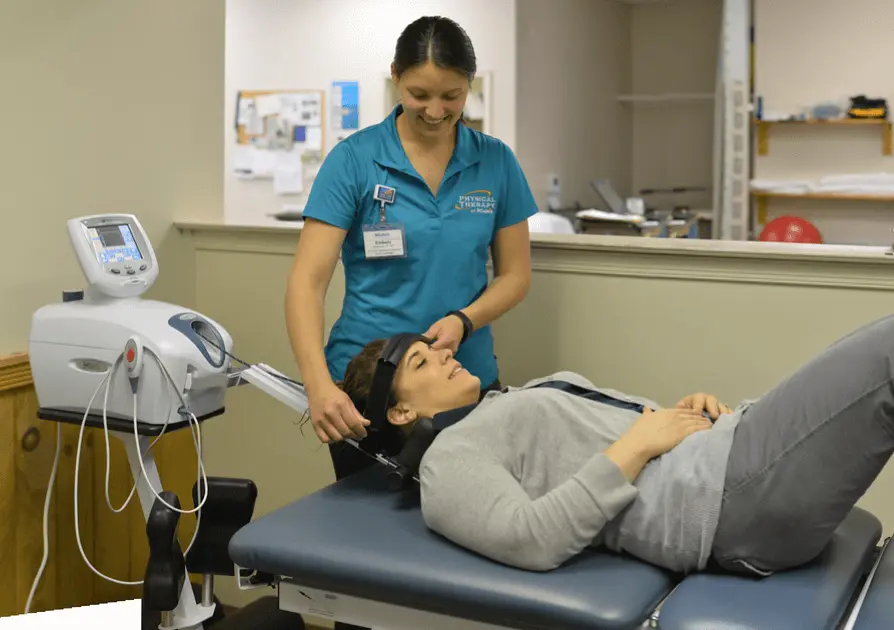 Physical Therapist assisting patient