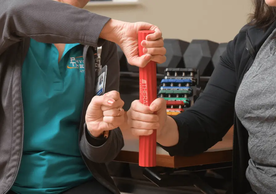 Physical Therapist working with patient