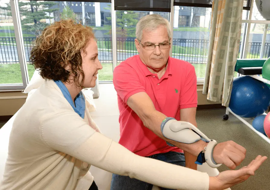 Physical Therapist working with patient