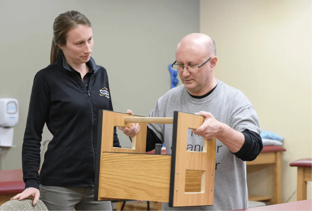 Physical Therapist assisting patient