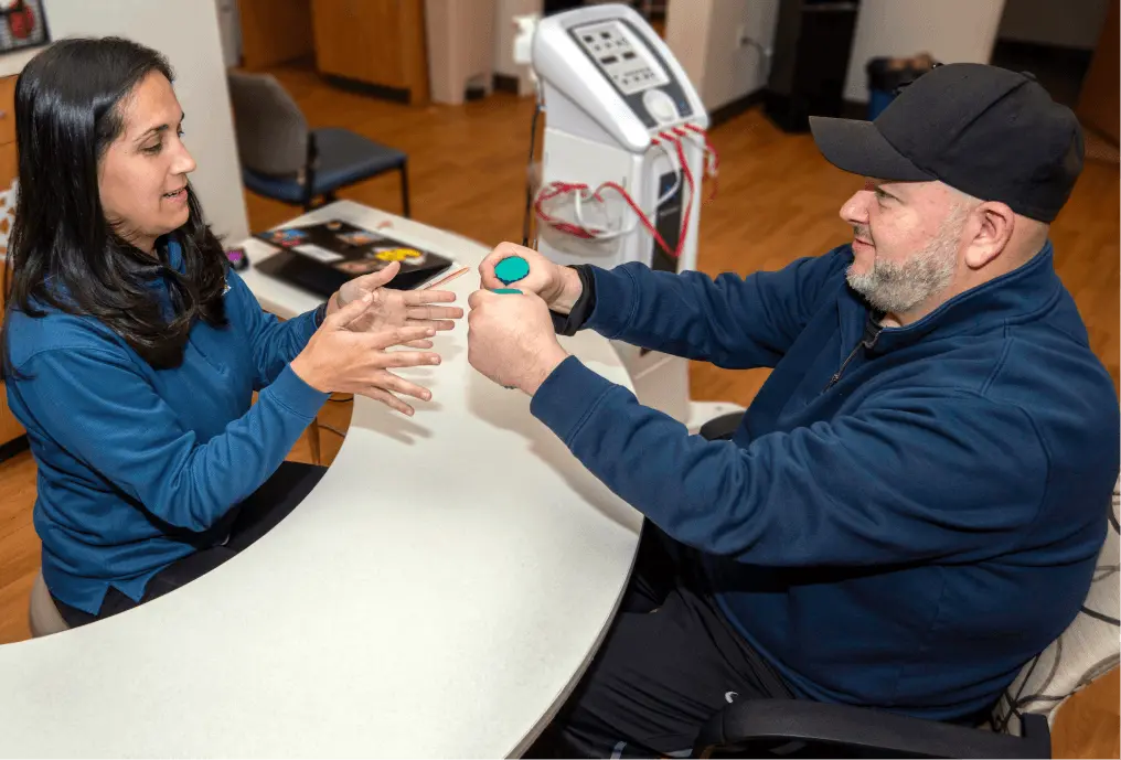 Physical Therapist working with patient