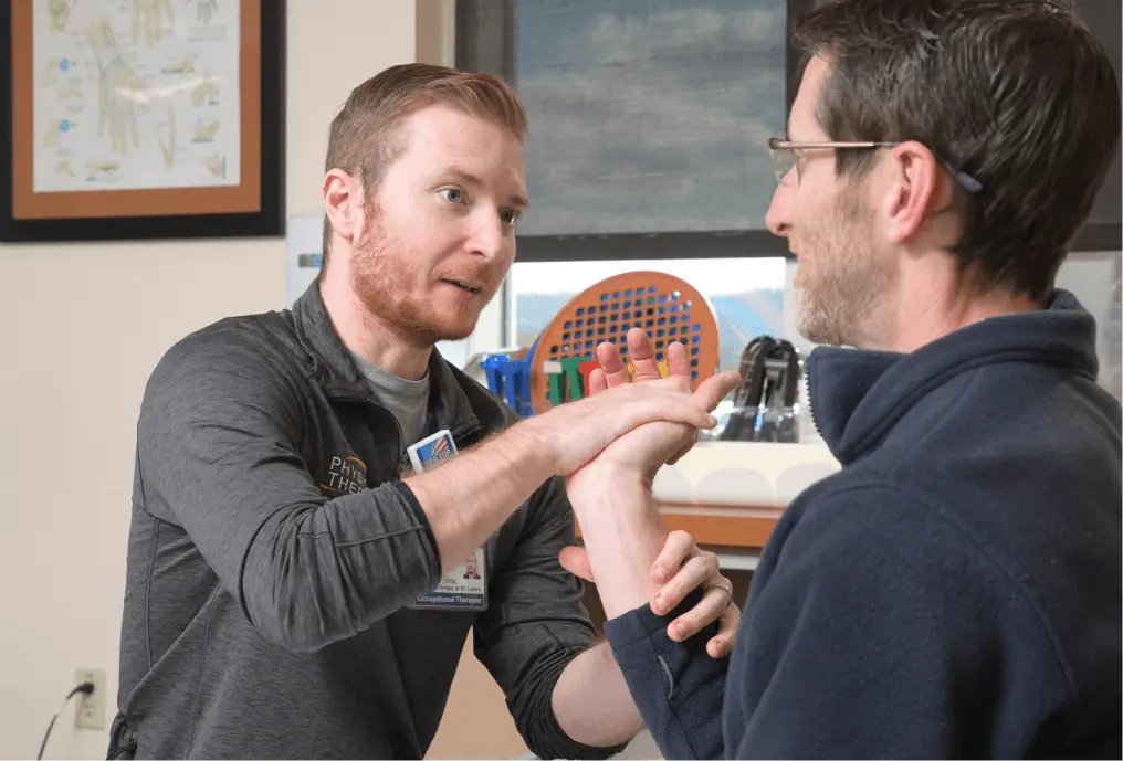 Physical Therapist working with patient