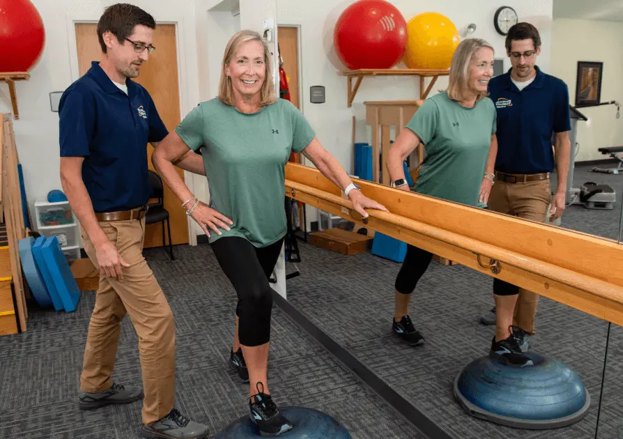 Physical Therapist assisting patient