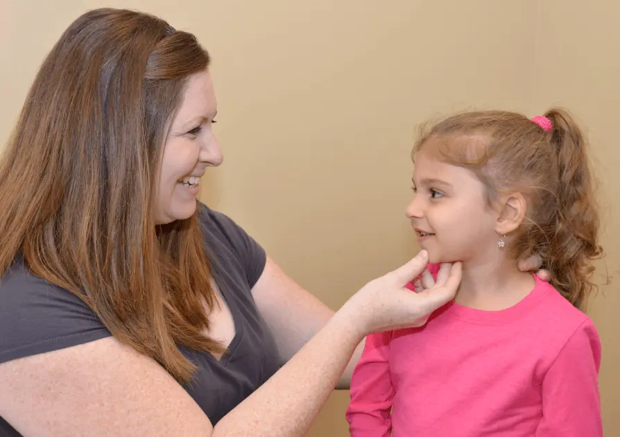 Physical Therapist working with a young child