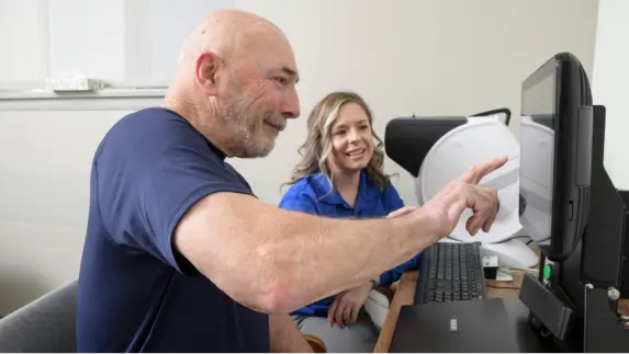 Nurse with patient looking at computer screen