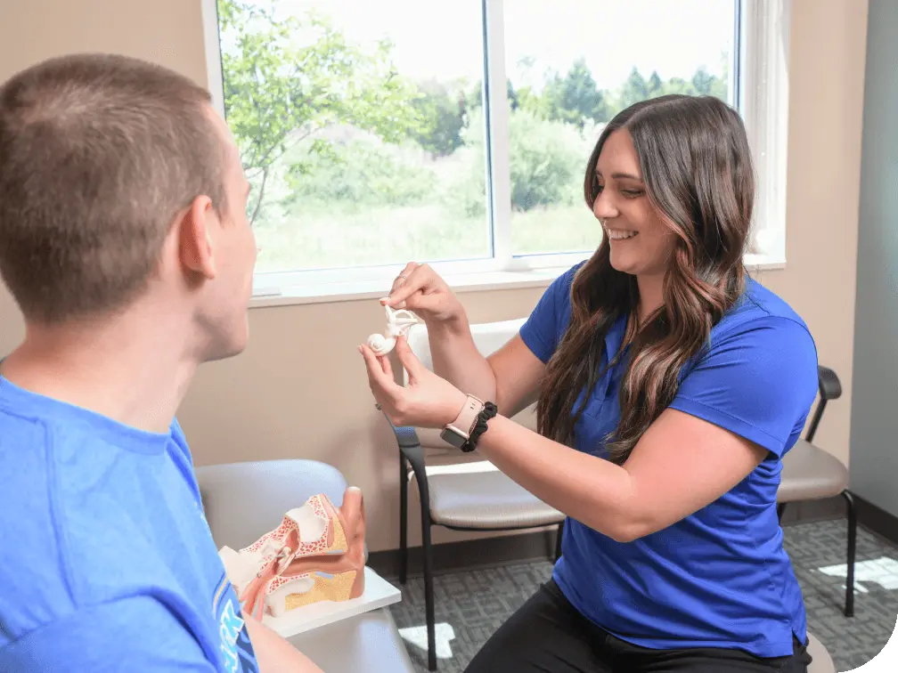 Physical therapist with patient