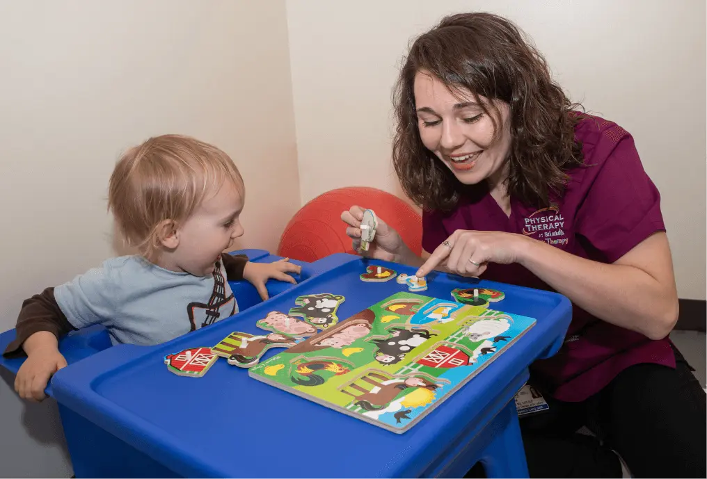 Physical Therapist working with toddler