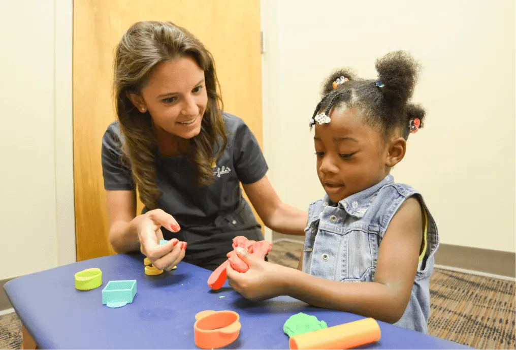 Physical Therapist working with a young child