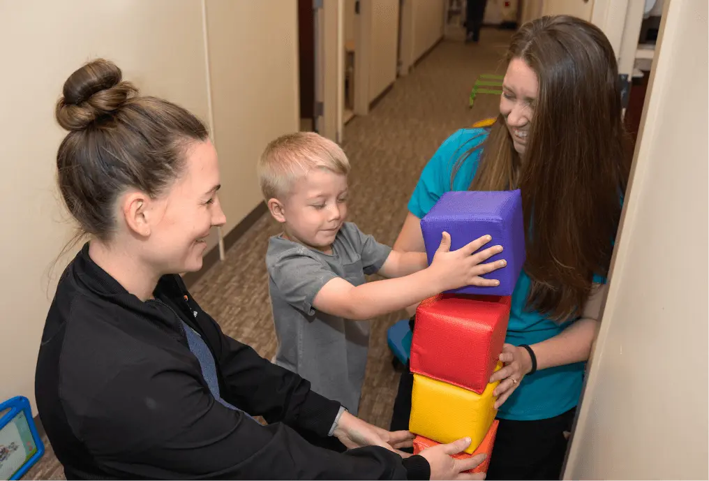 Physical Therapist working with young child