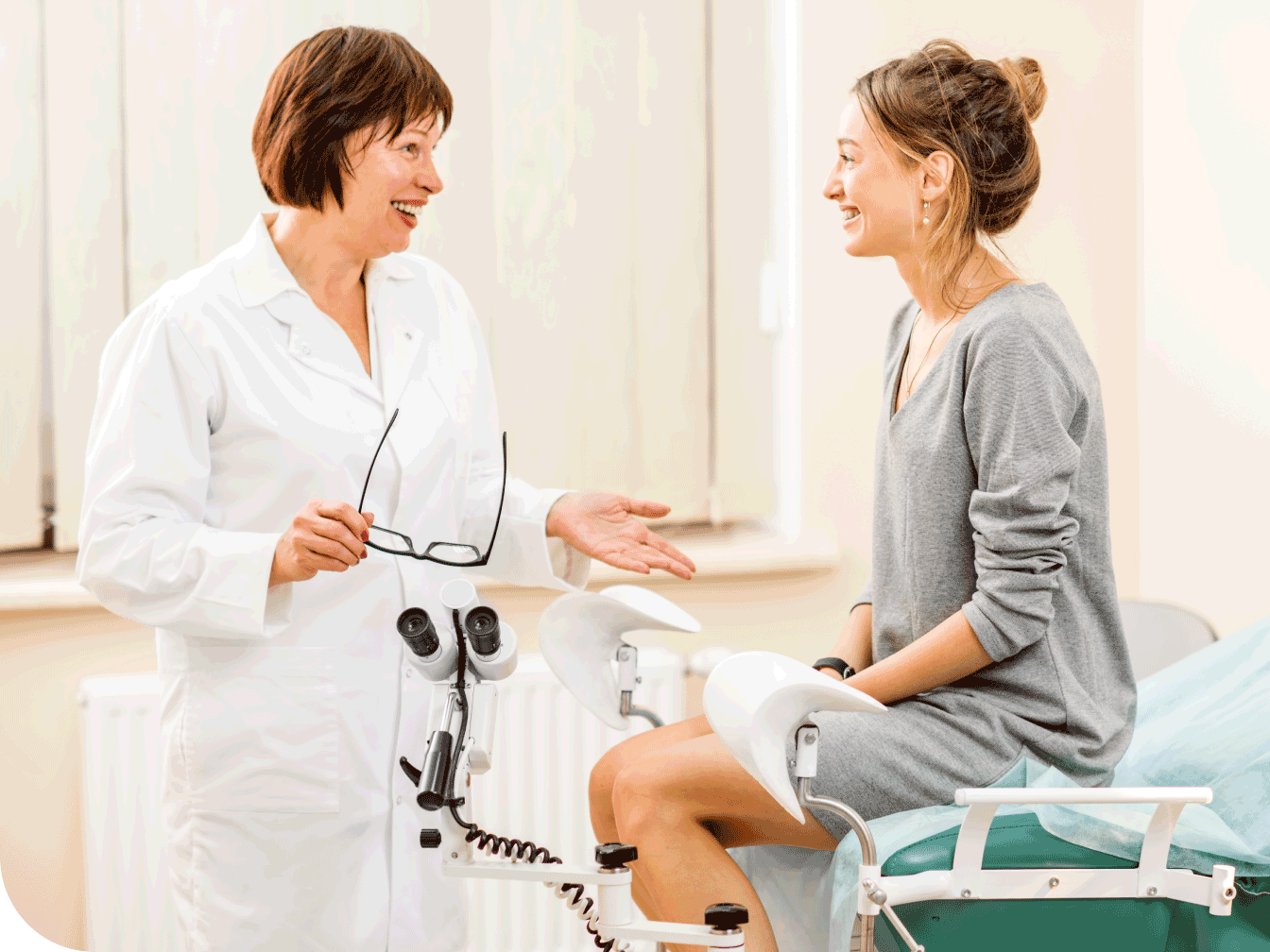 Doctor talking with postpartum patient