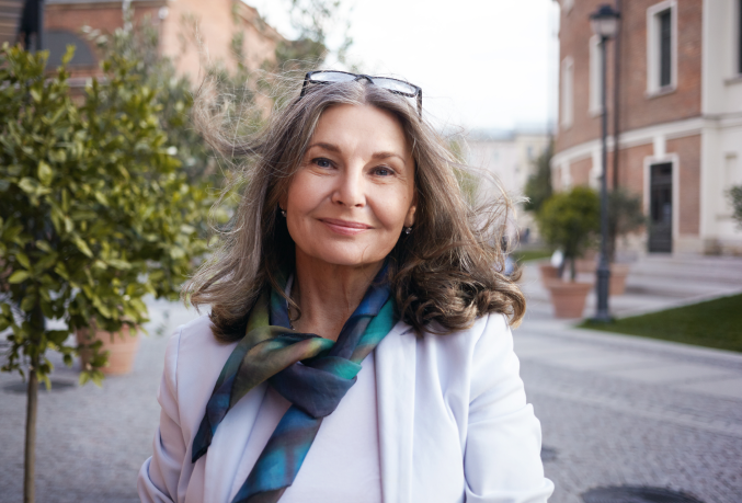 Woman smiling outdoors in a city