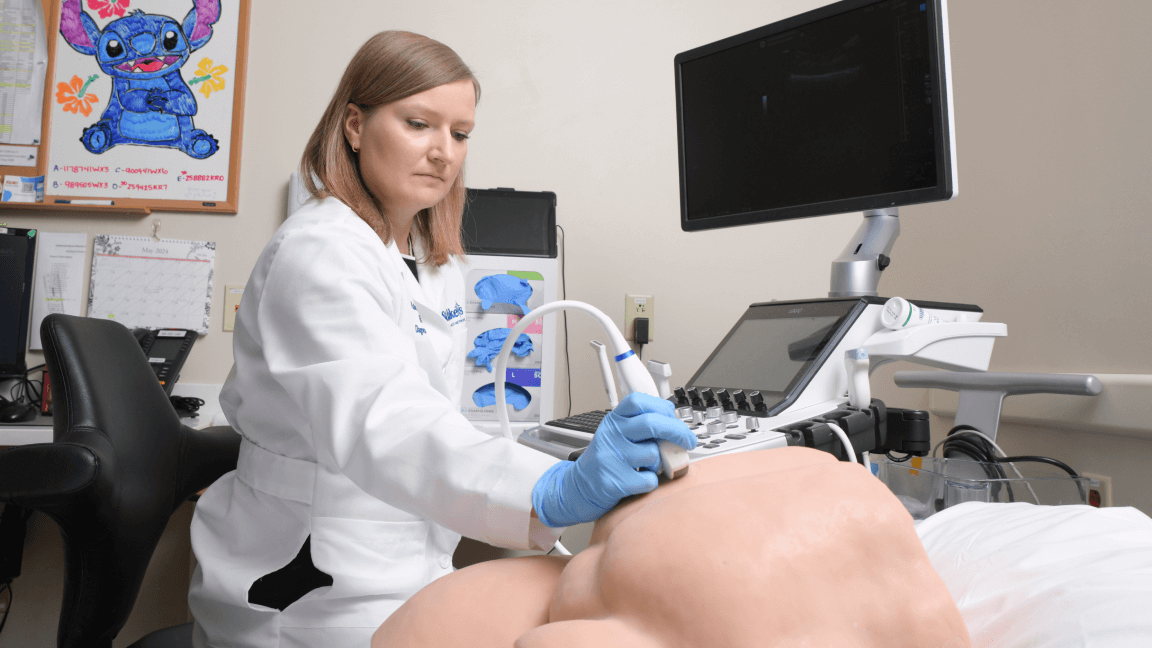 Female doctor performing ultrasound