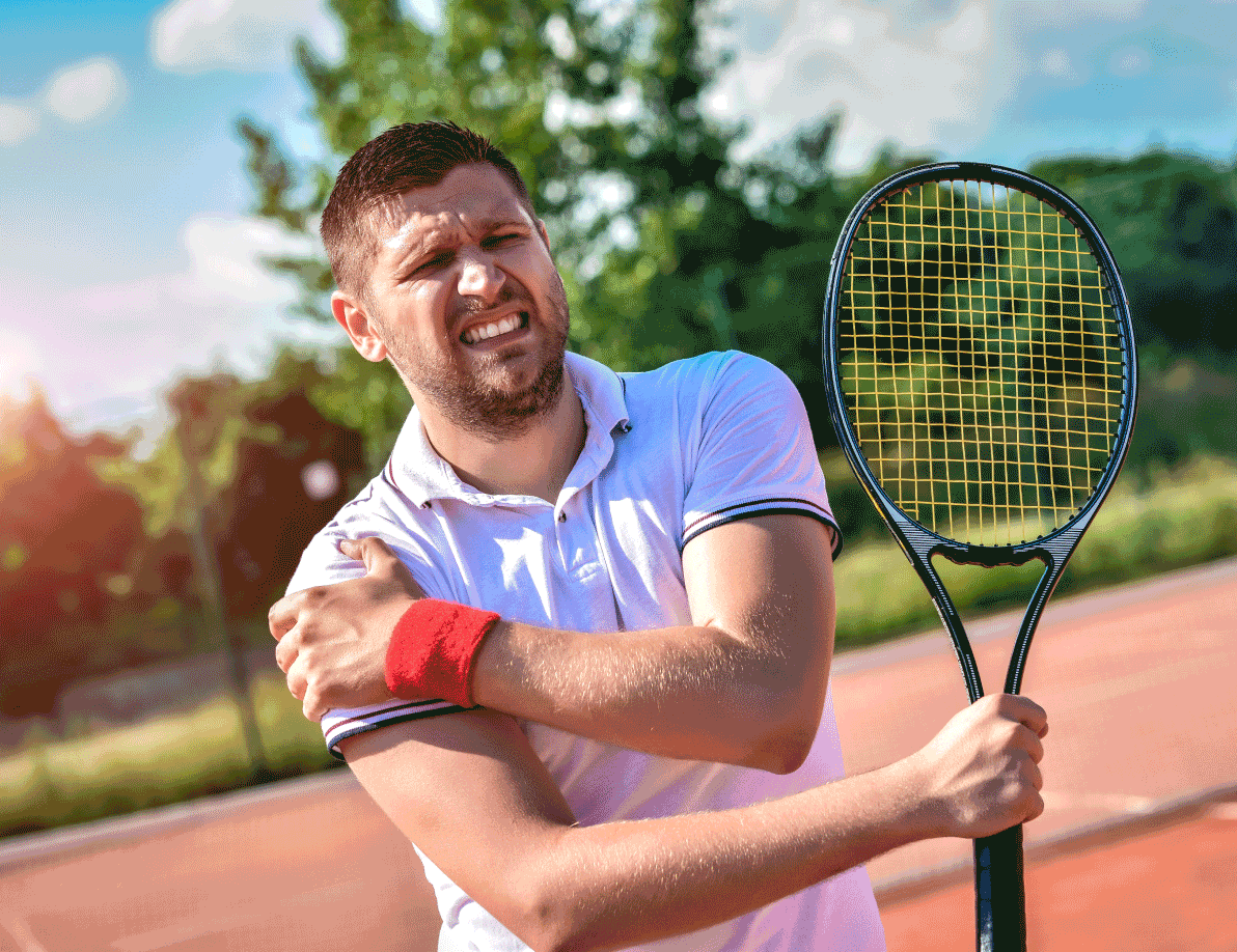Tennis player holding right shoulder